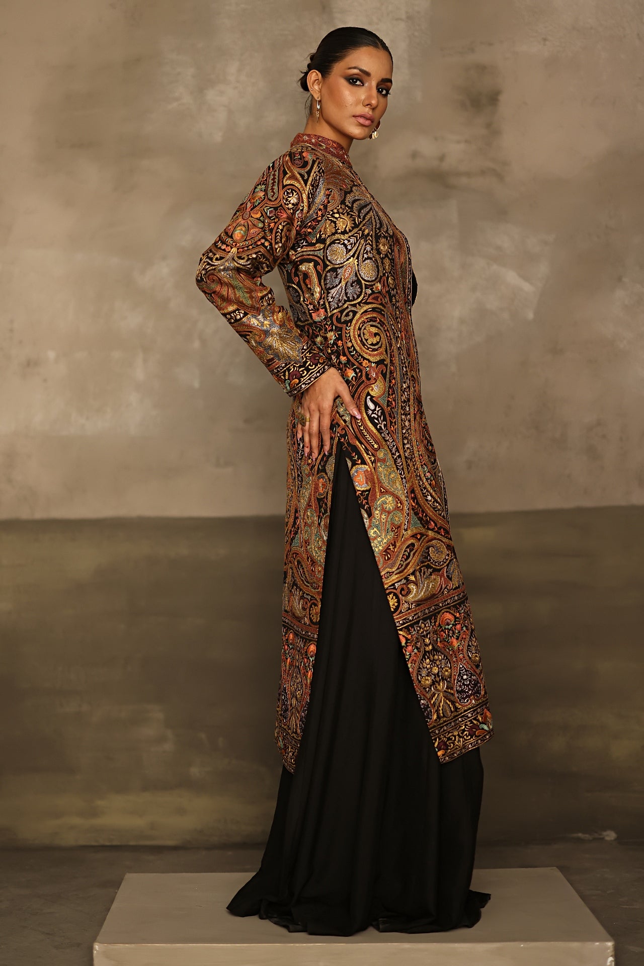 Aafrinish By Niazi Rabita Ali Rizwan Ul Haq Black Pita Tilla jacket adorned with intricate Kashida embroidery in hues of dull gold and silver zari Pakistan Fashion