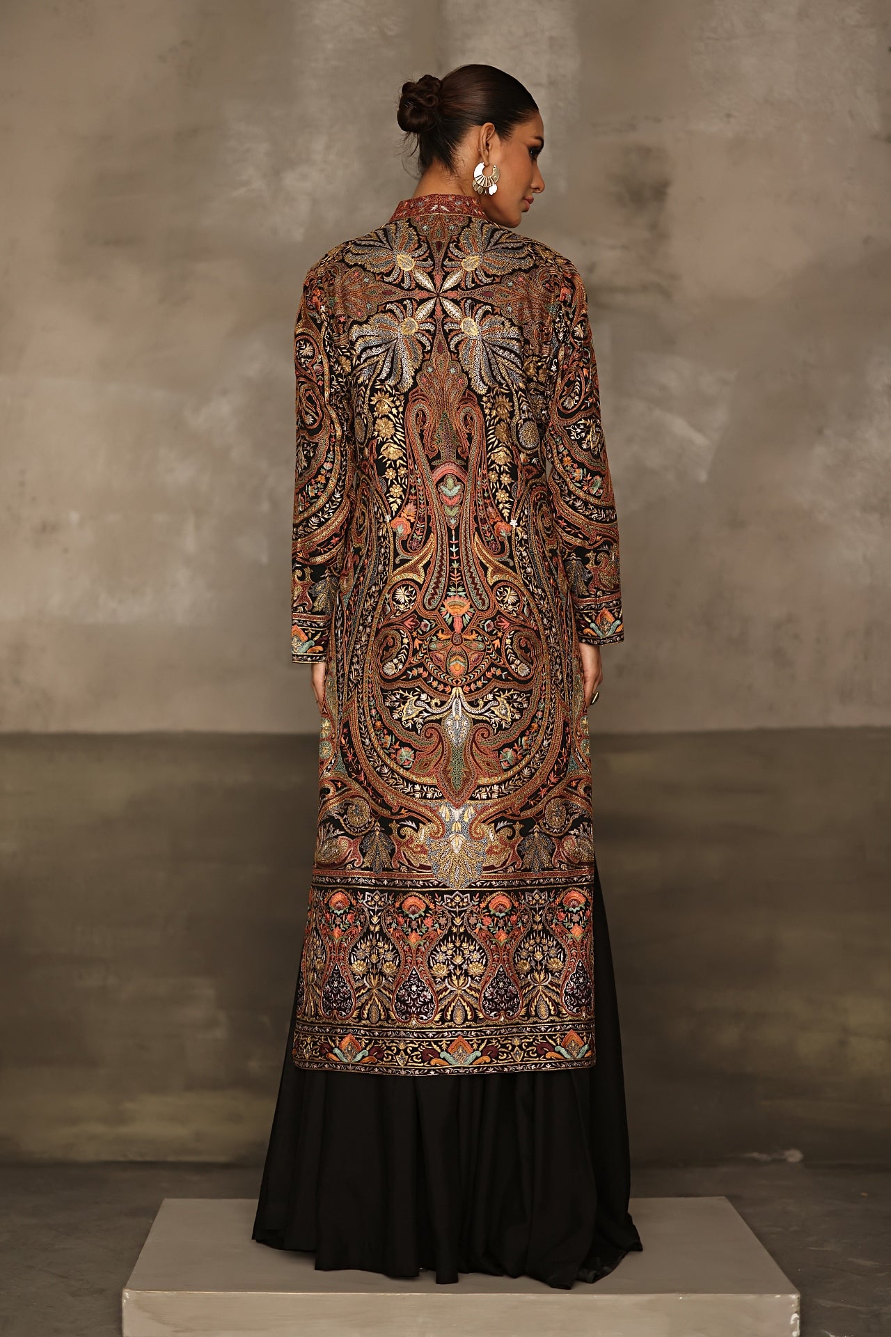 Aafrinish By Niazi Rabita Ali Rizwan Ul Haq Black Pita Tilla jacket adorned with intricate Kashida embroidery in hues of dull gold and silver zari Pakistan Fashion