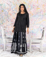 Load image into Gallery viewer, Rehma zaman black kurti black embroidery Chikan Kari Kurta Black on Black Splatter painting curly hair
