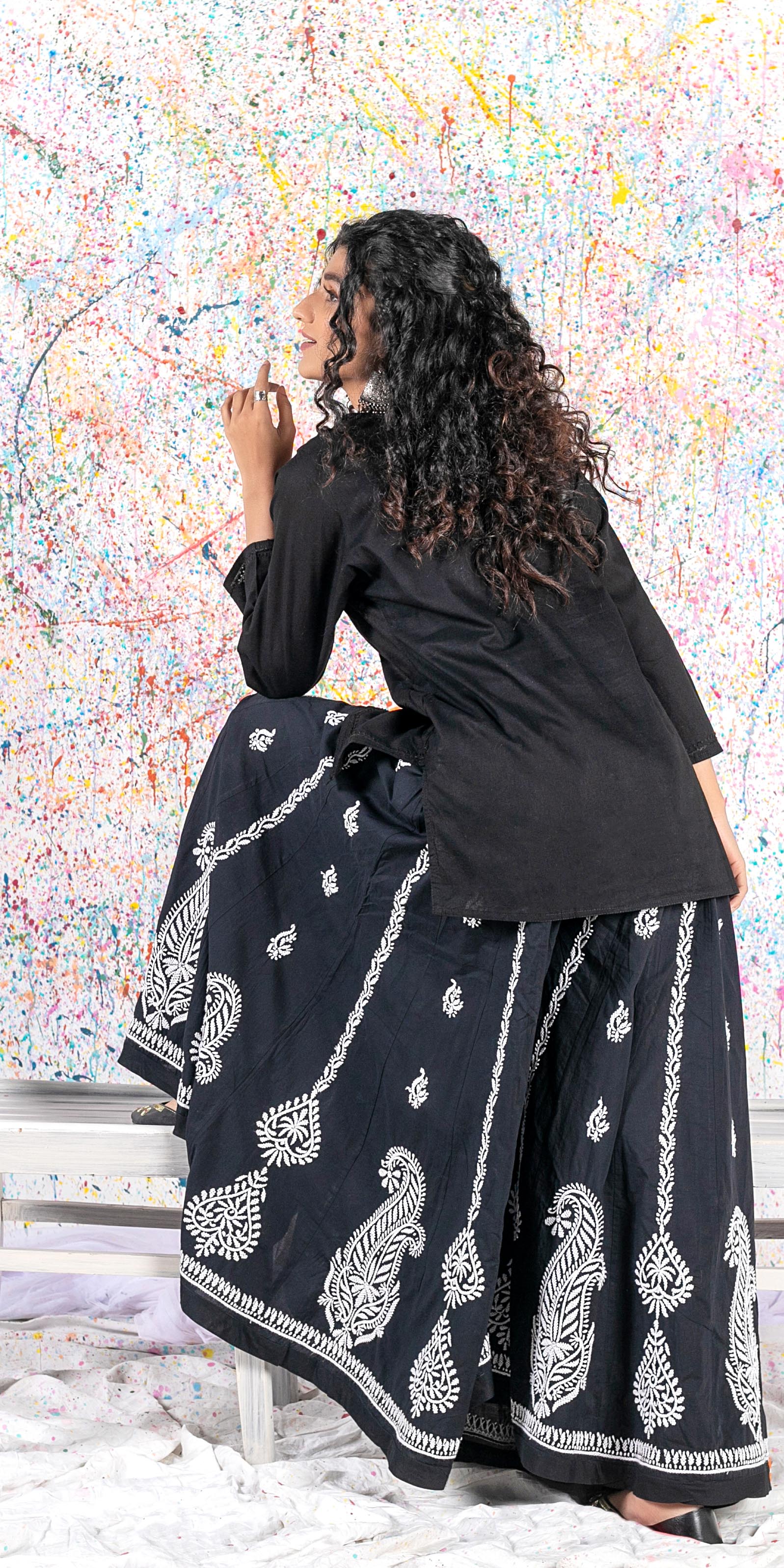Aafrinish Rehma zaman black kurti black embroidery Chikan Kari Kurta Black on Black Splatter painting curly hair back