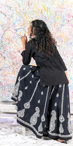 Load image into Gallery viewer, Aafrinish Rehma zaman black kurti black embroidery Chikan Kari Kurta Black on Black Splatter painting curly hair back

